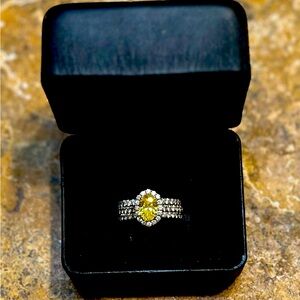 Canary Yellow diamond ring with diamond halo and diamond triple band